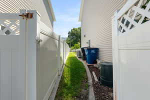 View of side of home featuring central AC unit