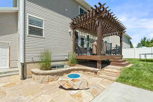 View of patio / terrace with a wooden deck and a pergola