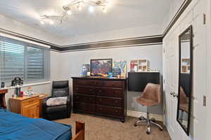Bedroom featuring carpet flooring