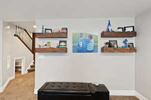 Detailed view of carpet flooring and baseboards