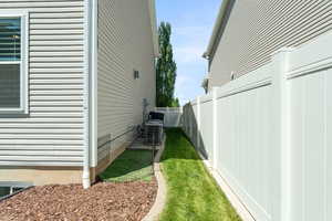 View of yard with central AC