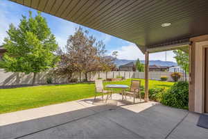 Covered patio with view of mountains.