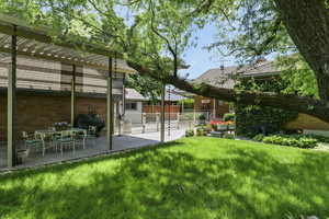 View of yard featuring a pergola and a patio area