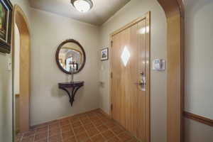 Foyer entrance featuring arched walkways