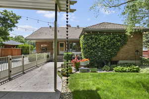 View of front of home with covered porch and brick siding