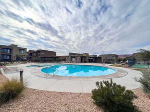 Community pool with a residential view