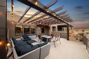 View of patio featuring an outdoor living space with a fire pit and a pergola