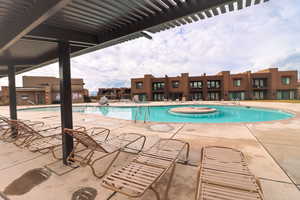 Community pool with a patio area