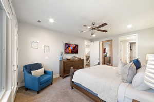 Bedroom featuring recessed lighting, light colored carpet, baseboards, and ceiling fan