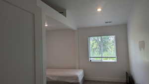 Bedroom featuring carpet flooring, baseboards, and recessed lighting
