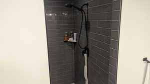 Bathroom view of a tile shower