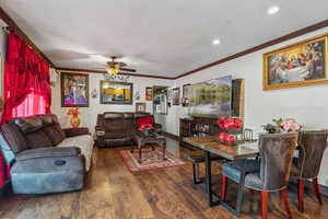 Living area featuring ornamental molding, a ceiling fan, wood finished floors, recessed lighting, and baseboards