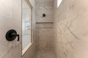 Bathroom with a tile shower