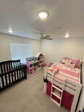 Bedroom featuring carpet flooring and ceiling fan