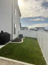 View of yard featuring cooling unit