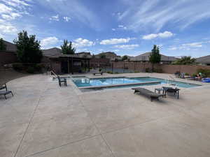 Community pool featuring a patio