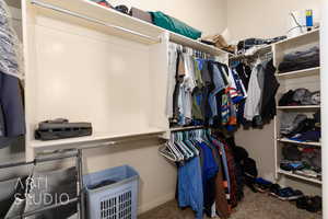 Walk in closet with carpet