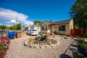 Bungalow-style house with a chimney and a patio area