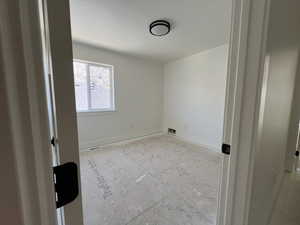 Unfurnished room featuring baseboards