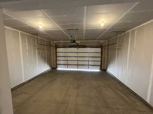 Garage featuring a garage door opener