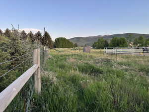 View of mountain background featuring rural landscape