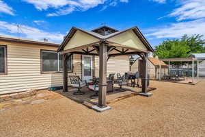 Back of property with a patio