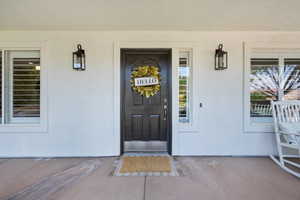 Doorway to property with a porch