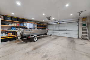 Garage with a garage door opener and recessed lighting