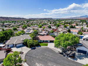 Aerial perspective of suburban area with a mountainous background