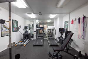 Exercise room featuring baseboards