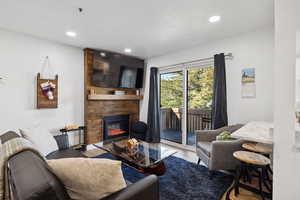 Living area featuring a fireplace and recessed lighting