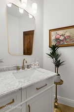 Bathroom with vanity and baseboards