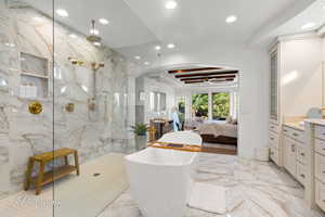 Full bath with recessed lighting, a soaking tub, marble tiled flooring, a marble finish shower, and vanity