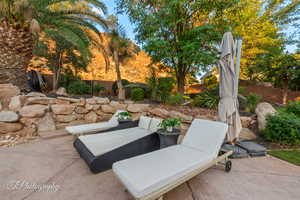 Fenced backyard featuring a patio area and outdoor lounge area
