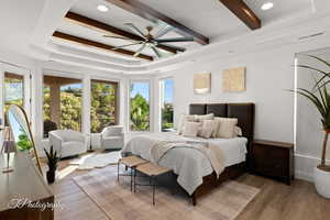 Bedroom featuring wood finished floors, beam ceiling, recessed lighting, baseboards, and a ceiling fan