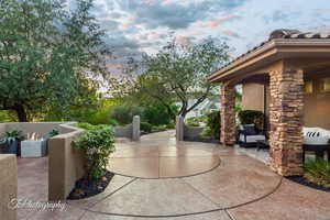 Patio terrace at dusk with a patio area and an outdoor hangout area