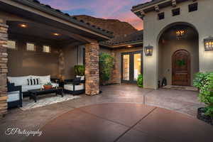Patio terrace at dusk with french doors, a patio, and outdoor lounge area