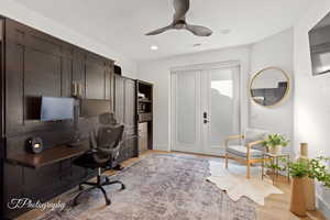 Office area featuring light wood-style flooring, a ceiling fan, and recessed lighting