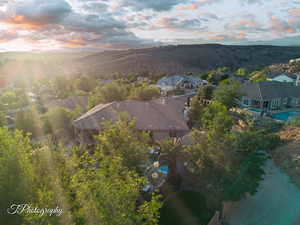 Aerial perspective of suburban area featuring a mountainous background