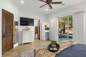 Bedroom with access to exterior, light wood-type flooring, recessed lighting, connected bathroom, and baseboards