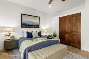 Bedroom featuring wood finished floors, baseboards, recessed lighting, and a ceiling fan