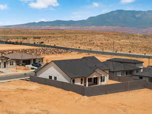 Aerial view of property and surrounding area with mountains and a desert landscape