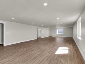 Empty room with recessed lighting, wood finished floors, and baseboards