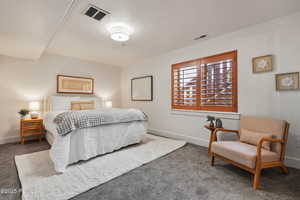 Bedroom with carpet and baseboards