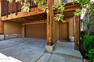 Garage featuring concrete driveway