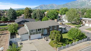 Aerial perspective of suburban area with a mountain backdrop