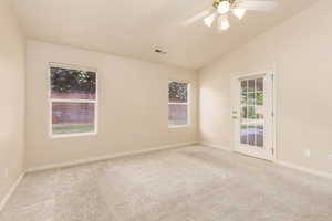 Primary bedroom with french door exit to covered patio
