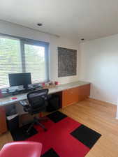 Office area featuring light wood floors