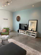 Living room with concrete flooring.