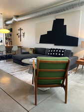 Living area featuring concrete flooring